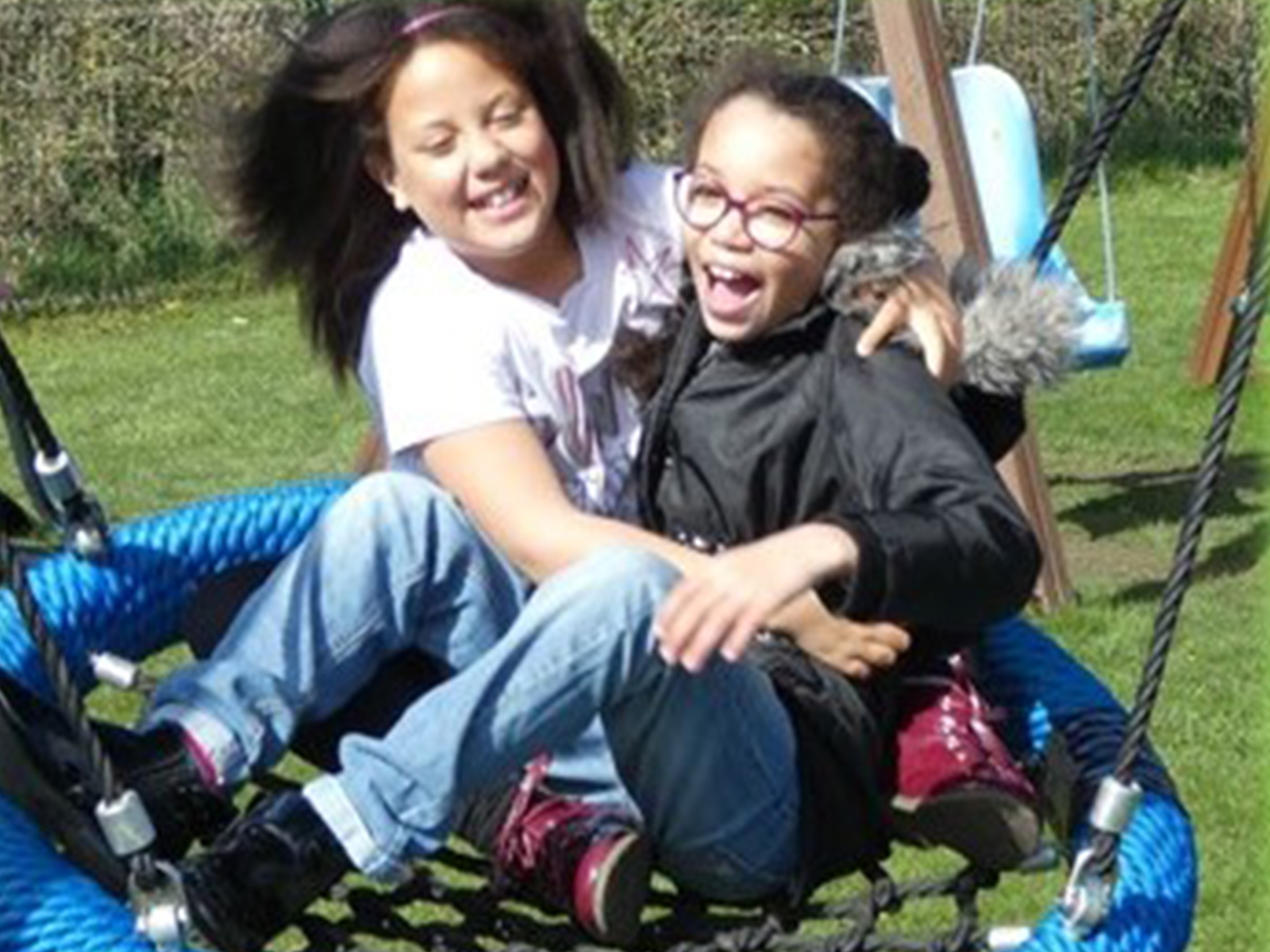 Kids playing on a swing