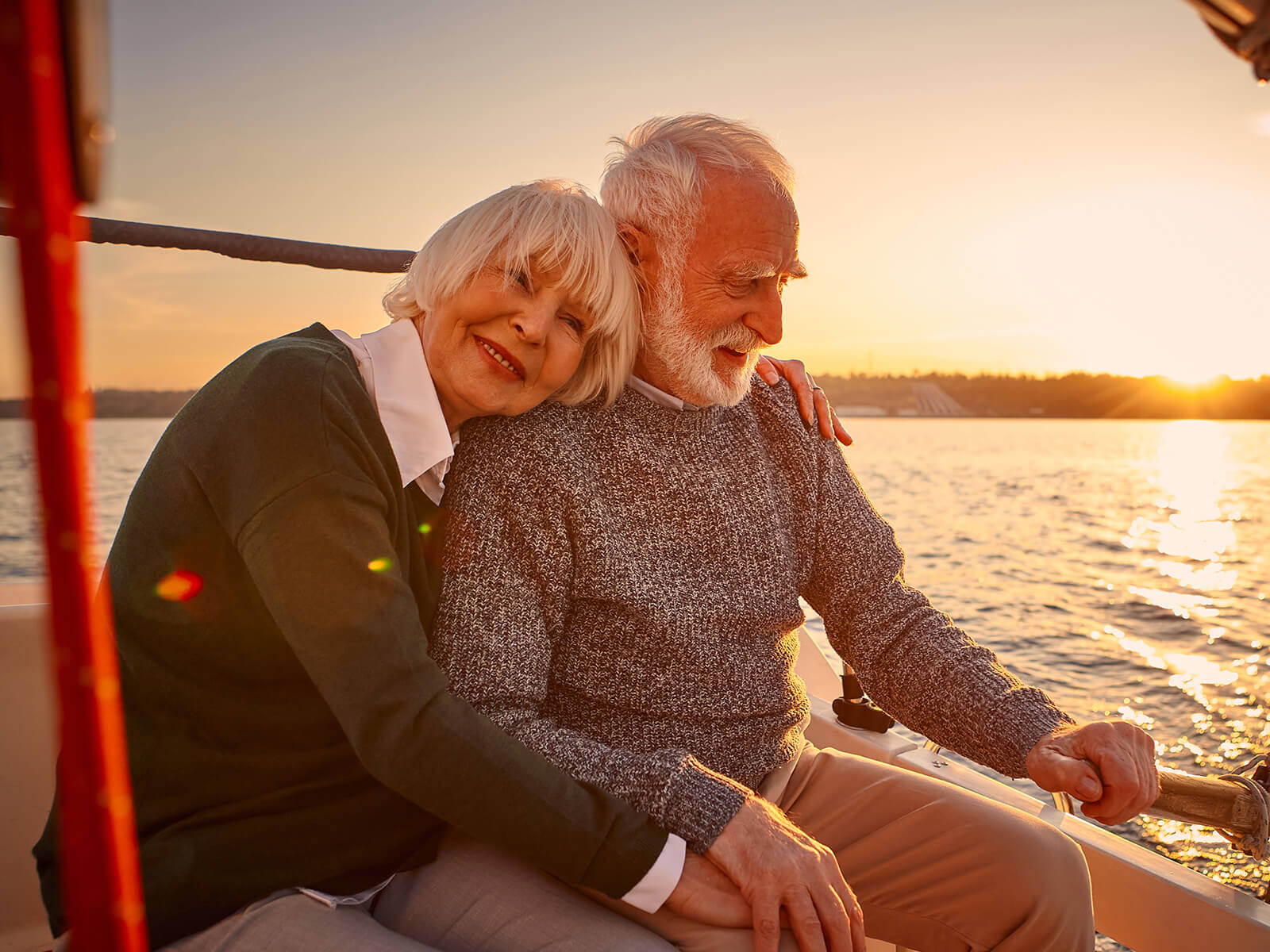 Two people hugging on a boat