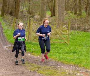 Two people running