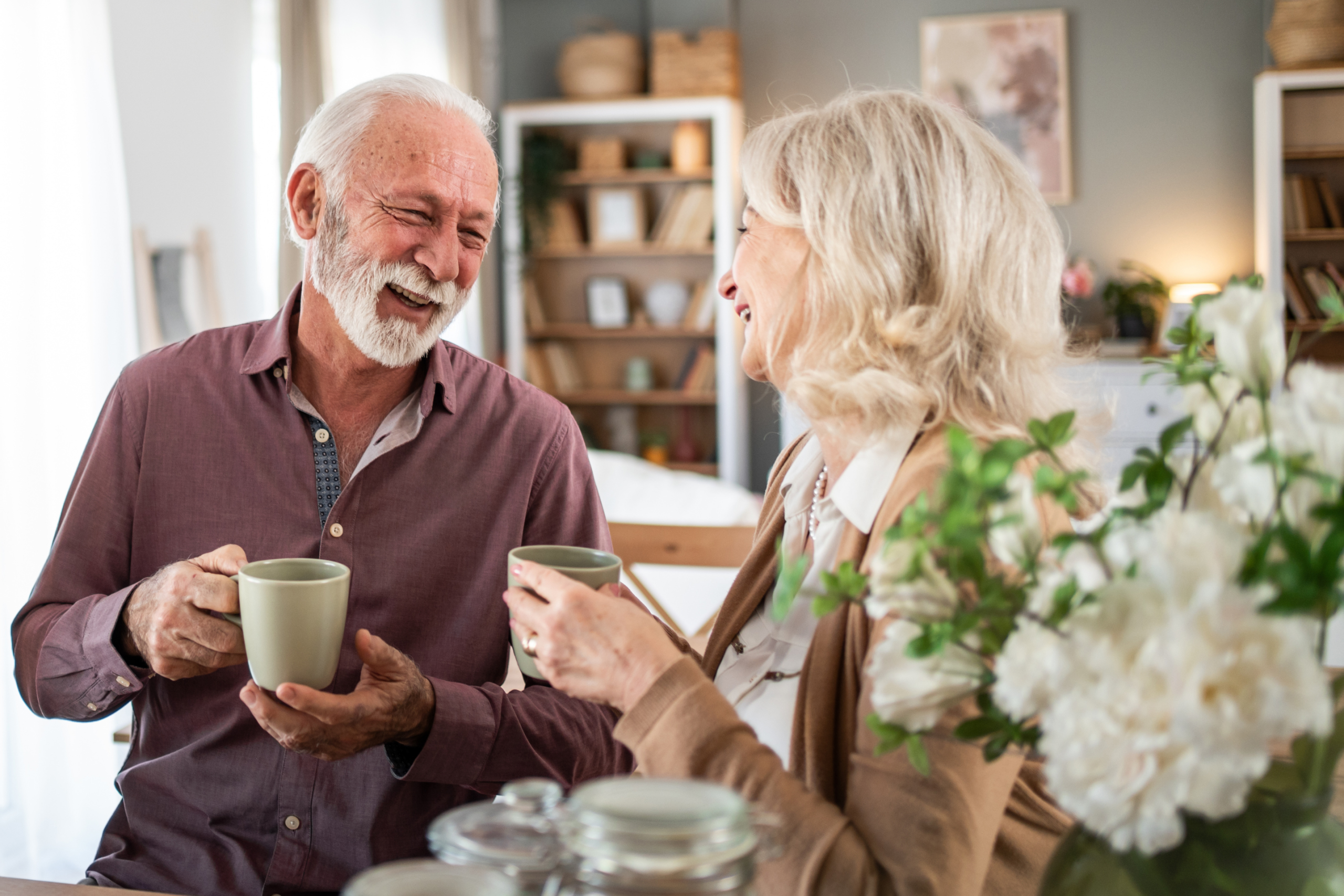 couple smiling over a cup of tea